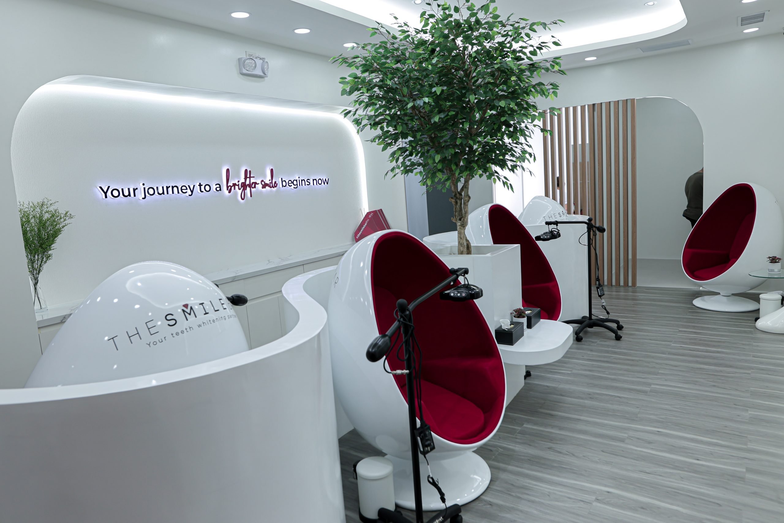 Interior lounge of The Smile Bar Bonifacio Stopover Pavilion with modern whitening chairs