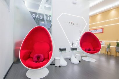 Interior lounge of The Smile Bar Vertis North Quezon City branch with signature whitening chairs