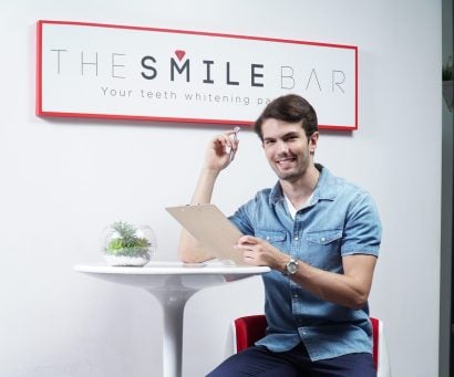 A man sitting at The Smile Bar Philippines during a professional LED teeth whitening consultation.